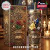 A collectible gold tumbler with Beauty and the Beast characters and roses, shown next to an elegant matching anniversary box.
