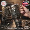 A rock-inspired tumbler with detailed skull motifs and band branding, shown with a matching box and metal accessories for a bold aesthetic!
