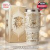A white and gold Bob Dylan tumbler with ornate design and matching box placed on a bright surface with a soft glowing background!