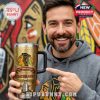 Man holding and pointing at a Chicago Blackhawks one hundredth anniversary gold tumbler in front of a bold team themed background!