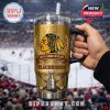 Close view of a Chicago Blackhawks gold anniversary tumbler held during a live hockey game!