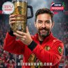 Chicago Blackhawks fan holding up a gold anniversary tumbler in celebration inside a packed stadium!