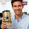 Man holding gold Dallas Cowboys YETI tumbler in an office!
