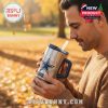 Man enjoying fall weather while holding Cowboys tumbler!