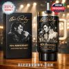 Elvis Presley tumbler and its black commemorative box sit side by side on a wooden table, highlighted by stage lighting in the background!