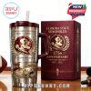 Collector’s edition FSU tumbler and packaging displayed with football props, highlighting its premium, sports-themed craftsmanship!