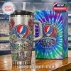 Grateful Dead tumbler with colorful embossed details and tie-dye packaging.