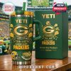 Green Bay Packers 107th Anniversary YETI mug with box placed on a table at the stadium.