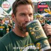 Man sipping from Packers 107th Anniversary YETI mug at fan tailgate event.