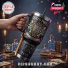 A black and gold Hocus Pocus themed tumbler with vibrant mystical elements, held by a hand in a magical candlelit atmosphere!