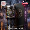 A gothic-style tumbler with matching box featuring spellcraft details, set against a mystical foggy candlelit backdrop!
