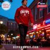 Man wearing red Indiana champs hoodie walking in a city at night!