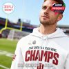Man wearing a white Indiana champs hoodie standing on a football field!
