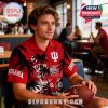 Man wearing Indiana Hoosiers Hawaiian shirt in sports bar setting with visible logos and palm graphics.