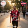 Man walking on college street wearing Indiana Hoosiers 2026 championship Hawaiian shirt with red and black design.