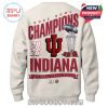A man wearing a white Indiana Hoosiers hoodie featuring Rose Bowl Champions design with a stadium and football imagery behind him!