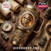 Indiana Jones anniversary tumbler with explorer tools and Raiders-themed decor on wooden background.