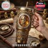 Indiana Jones collector tumbler held in hand with film-inspired props and golden adventure theme.