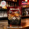 Close-up of a red Metallica 45th anniversary whiskey glass on a bar, decorated with raised imagery and gothic text!