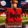 Nebraska Huskers red letter whiskey bottle with wooden stopper on football field!