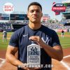 Fan holding the New York Yankees 122nd Anniversary Whisky Bottle at the stadium, with the team logo and anniversary details clearly visible.