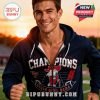 Male model wearing a navy blue Ole Miss Champions hoodie standing on a football field with sunset lighting!