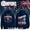 Front and back view of navy blue Ole Miss Champions hoodies featuring mascot helmet and trophy themed graphics!