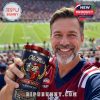 Man smiling in stadium holding Ole Miss Sugar Bowl Champions tumbler with mascot and trophy design.
