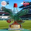 Eagle shaped bottle with red cap positioned on a football field in a stadium!