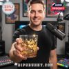 A man presenting a gold-embossed Pokémon glass in a podcast or recording studio, with Pikachu and Charizard artwork on display!