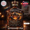 Pink Floyd collector bottle displayed on a table with warm lighting and iconic design!