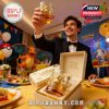 A smiling man in a tuxedo celebrates with a raised 30th Anniversary Pokémon glass surrounded by a lively party full of Pokémon decorations and food!