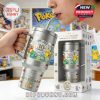 A Pokemon anniversary tumbler with a straw is being used by a person indoors with colorful Pokemon posters in the background!
