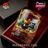 A luxury gift box containing a Pokémon 30th Anniversary commemorative glass featuring Pikachu, Bulbasaur, and Squirtle in formal outfits, illuminated with glowing electric effects!