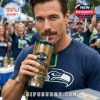 Man drinking from Seattle Seahawks YETI tumbler at outdoor fan event with crowd behind!