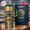 Seattle Seahawks YETI tumbler with matching collector box displayed on table in stadium!