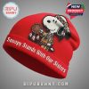 Red beanie with Snoopy in Native American attire holding a dream catcher with text: Snoopy Stands With Our Sisters.!