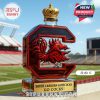Letter C shaped red glass whiskey bottle with gold crown cap displayed in a stadium!