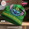 Stitch wearing a green St. Patrick's Day beanie hat, smiling mischievously.