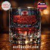 Stranger Things 10th Anniversary whiskey glass with Hellfire Club logo.