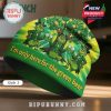 Grinch-themed beanie with clovers, coins and beer mugs. Text: I'm only here for the green beer.!