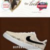 A custom beige sneaker with black Nike logo and personalized tour branding, including 
