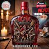 Front-facing bottle of AC/DC 53rd anniversary whiskey featuring a red rose wood cap and detailed rock-inspired label, placed in a vintage-style setting!