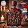 Dark red AC/DC whiskey bottle with sealed wax top, rich label art including lightning bolts, guitars, and vintage horns, surrounded by soft candlelight and rock décor!