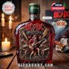 Whiskey bottle celebrating AC/DC's 53-year milestone with Jameson green top and signature red tones, lit by candlelight among rock music memorabilia!