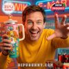 This image shows a tall handled tumbler with bright cartoon artwork placed beside its matching packaging highlighting the full design and collectible presentation!