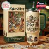 Tom and Jerry 85th Anniversary tumbler and gift box with character artwork on a wooden surface, surrounded by comic panels.