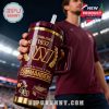 Washington Commanders insulated tumbler held by a fan inside a football stadium!