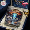 A glass with 'BOSTON Rock & Roll Band 50th Anniversary 1976-2026' and a UFO graphic, nestled in a satin-lined box.!