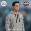 Man wears gray hoodie with Patriots logo and Super Bowl LVII logo.!